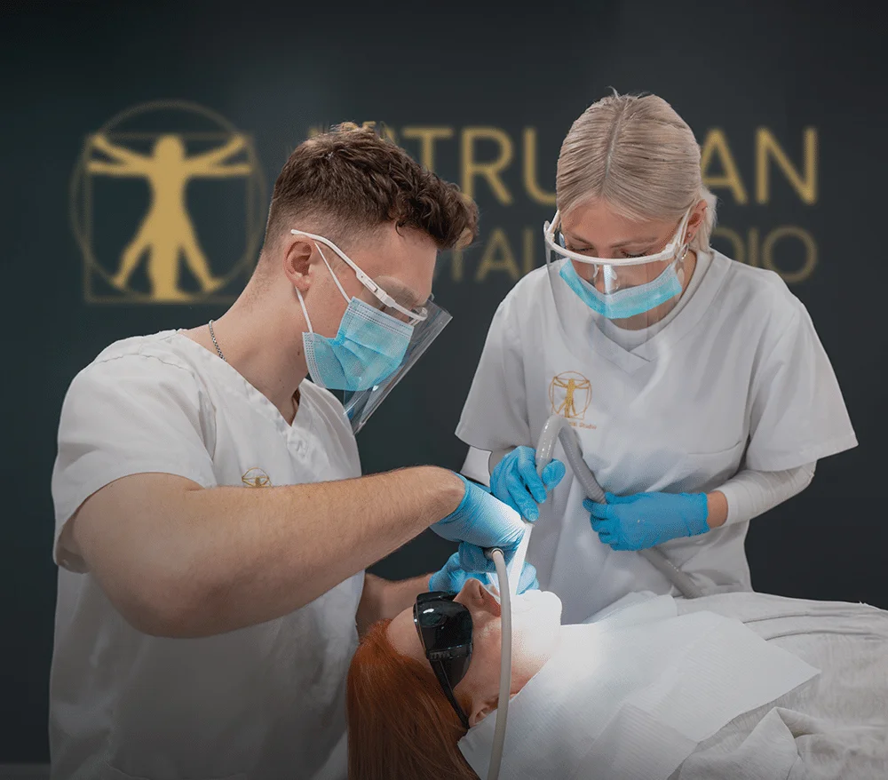 Vitruvian clinicians caring for a patient during dental treatment